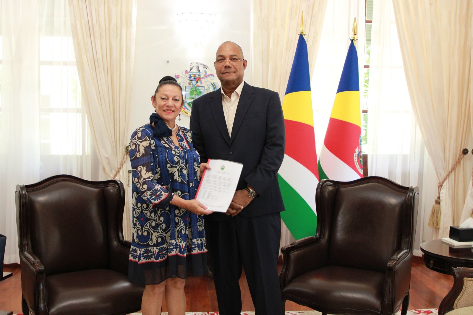 The Mayor of Victoria, Josie Michaud-Payet, yesterday, Tuesday 24th March 2026, held a high-level meeting with the President of the Seychelles, Patrick Herminie, to present a comprehensive vision and strategic roadmap for the capital’s future development. The engagement was characterised by a constructive and forward-looking dialogue centred on transforming Victoria into a culturally vibrant, historically grounded, and economically dynamic city. Reflecting on her first three weeks in office, Mayor Michaud-Payet conveyed a smooth transition into her leadership role, underscored by active engagement with a broad spectrum of stakeholders. These include community representatives, development partners, and members of the diplomatic corps. She emphasised her commitment to inclusive governance, noting that ongoing consultations are integral to shaping policies that reflect the aspirations and needs of the wider population. Central to the discussions was the Mayor’s strategic vision for a modernised and revitalised Victoria. She outlined a series of integrated initiatives designed to enhance urban life through cultural enrichment, infrastructure modernisation, and increased public participation. These initiatives are the result of collaborative input from multiple sectors, ensuring a cohesive and forward-thinking framework for the city’s development. Among the key proposals presented was the extension of business operating hours beyond 4:00 p.m. The Mayor highlighted that this measure would stimulate economic activity, improve accessibility to goods and services, and contribute to a more vibrant and engaging urban environment during evening hours. In addition, she introduced plans for the establishment of a dedicated policing unit for Victoria. This initiative aims to strengthen public safety by improving response times and ensuring more effective coordination in addressing urban challenges, thereby fostering greater confidence among residents and visitors alike. Further advancing her development agenda, the Mayor presented the “Victoria Refleri” Fund an innovative platform intended to mobilise support from private sponsors, stakeholders, and non-governmental organisations. The fund is designed to facilitate strategic partnerships and secure resources necessary to implement transformative projects that will enhance the city’s attractiveness and long-term value. In response, President Herminie commended the Mayor’s proactive leadership and strategic clarity. He advised that the proposed initiatives be consolidated into a structured and comprehensive framework for submission to the Cabinet of Ministers. This approach, he noted, would ensure coordinated, coherent, and sustainable implementation at the national level. The President also emphasised the importance of establishing a clearly defined institutional mandate for the Mayor’s Office. Such a framework would provide the necessary governance structure and authority to effectively execute the proposed vision and deliver measurable outcomes. Overall, the meeting underscored a shared commitment between national and local leadership to drive innovation, strengthen institutional partnerships, and enhance the quality of life for the population of Seychelles at large, as well as for visitors and tourists.